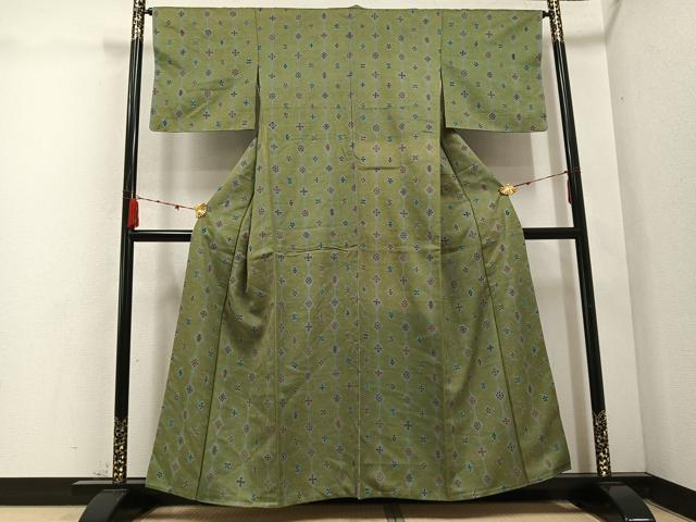 平和屋着物●上質な小紋 紬地 型染め 舞花文 油色地 正絹 逸品 AABD0805ph