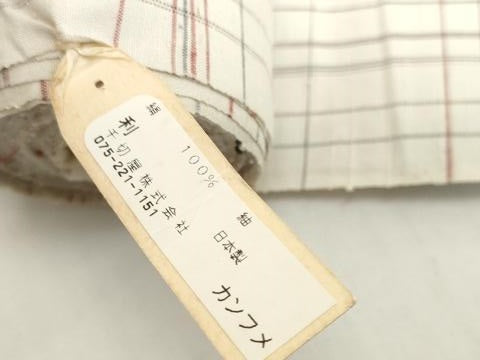 平和屋着物●京都の和装業の老舗一門 千切屋 紬 反物 着尺 古紅花玉絣 格子 証紙付き 逸品 未使用 DABH2307zzz