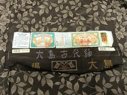 平和屋着物●本場大島紬 カタス9マルキ 泥染め 枝花文 大島古代紬謹製 証紙付き 正絹 逸品 未使用 AABF0272fy
