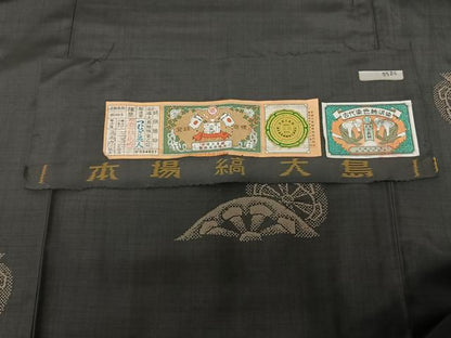 平和屋着物●本場縞大島紬　泥染め　源氏車文　黒地　つむぎ美人謹製　証紙付き　ロング丈　正絹　逸品　未使用　AABF5447fy