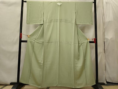 平和屋着物▽京都の和装業の老舗一門　千切屋　色無地　単衣　寿光織　紋意匠　染柳色　反端付き　正絹　逸品　未使用　AABI0155st