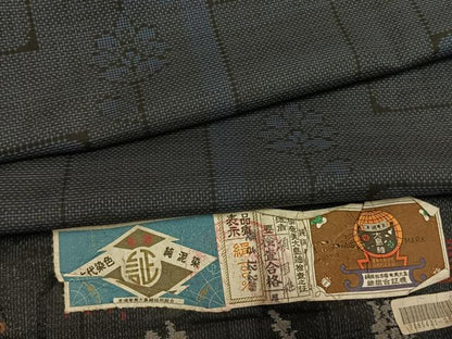 平和屋着物●本場大島紬　一元7マルキ　泥染め　草花文　小田急百貨店扱い　碩国雄作　証紙付き　正絹　逸品　未使用　AABI1374fy