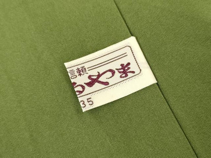 平和屋着物●石川県指定無形文化財　牛首紬　白山工房　手織り　色無地　松葉色　まるやま扱い　証紙付き　正絹　逸品　AABI5213cs
