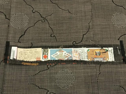 平和屋着物●本場大島紬　9マルキ　純泥染　手織　雪輪文　ますいわ屋扱い　興紬商店謹製　証紙付き　正絹　逸品　AABK1400fy