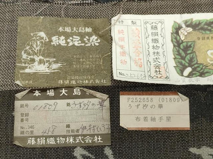 平和屋着物●都喜ヱ門 本場大島紬 9マルキ 純泥染め うず汐の華 藤絹織物謹製 証紙付き 正絹 逸品 CABB0242gh