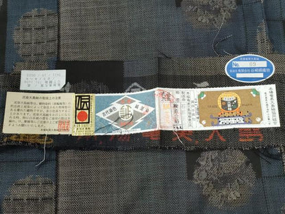 平和屋着物●本場大島紬 9マルキ 泥染め 雪輪吉祥花文 石原正宏作 証紙付き 正絹 逸品 未使用 CABC6748yc