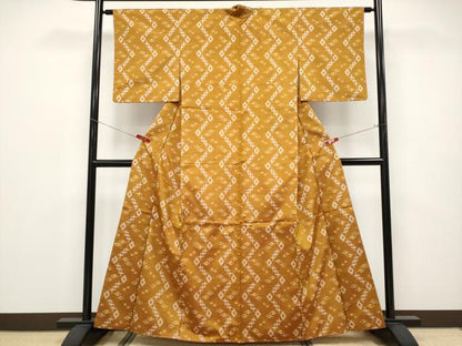 平和屋着物●極上　本場琉球絣　手おり　赤嶺カマ作　狐色地　証紙付き　逸品　未使用　CYAA4682s6