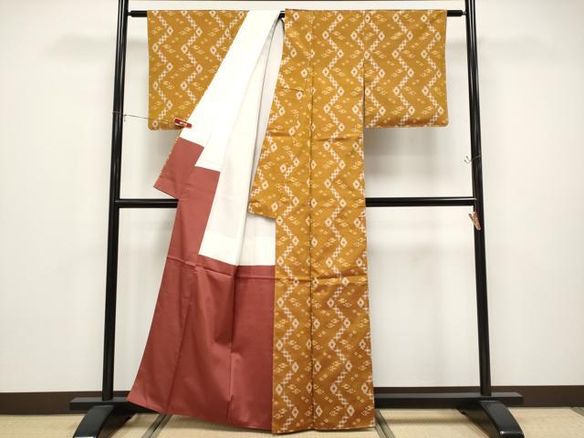 平和屋着物●極上　本場琉球絣　手おり　赤嶺カマ作　狐色地　証紙付き　逸品　未使用　CYAA4682s6