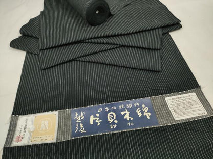 平和屋着物●小千谷　紺仁　越後片貝木綿　反物　着尺　縞　黒地　小千谷織物謹製　証紙付き　木綿　逸品　未使用　DAAV8409zzz