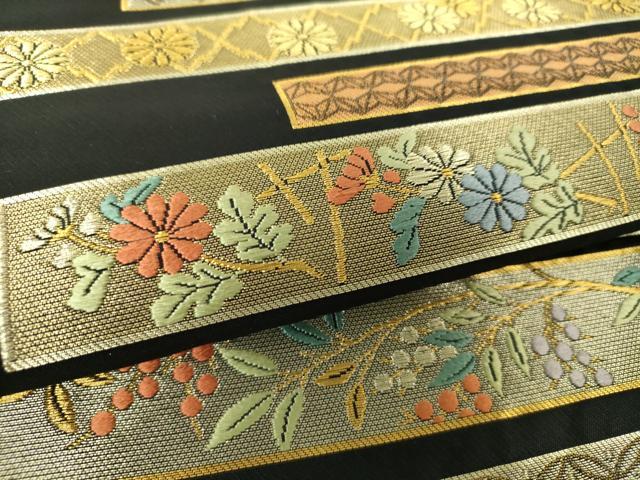 平和屋着物●西陣の名門 本家加納 つけ帯 横段舞蝶花鳥文 黒地 金糸 越後絣扱い 正絹 逸品 未使用 DAAY1028ps