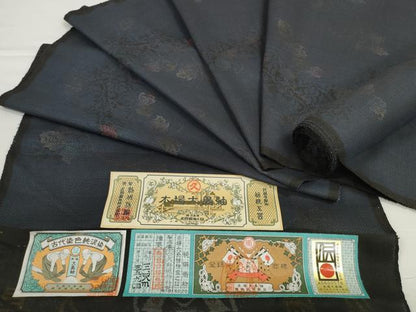 平和屋着物●本場大島紬　反物　着尺　9マルキ　古代染色純泥染　花唐草文　久野織物謹製　証紙付き　逸品　未使用　DABD8538zzz