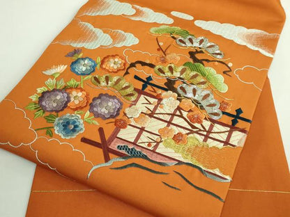 平和屋着物●極上　塩瀬　九寸名古屋帯　総刺繍　雲取り風景文　金銀糸　人参色地　逸品　DZAB1818kh6