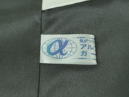 平和屋本店●希少　本場筑前博多織　大倉織物　誠之輔　お召　風通織　黒地　証紙・反端付き　逸品　未使用　DZAB4200kh6